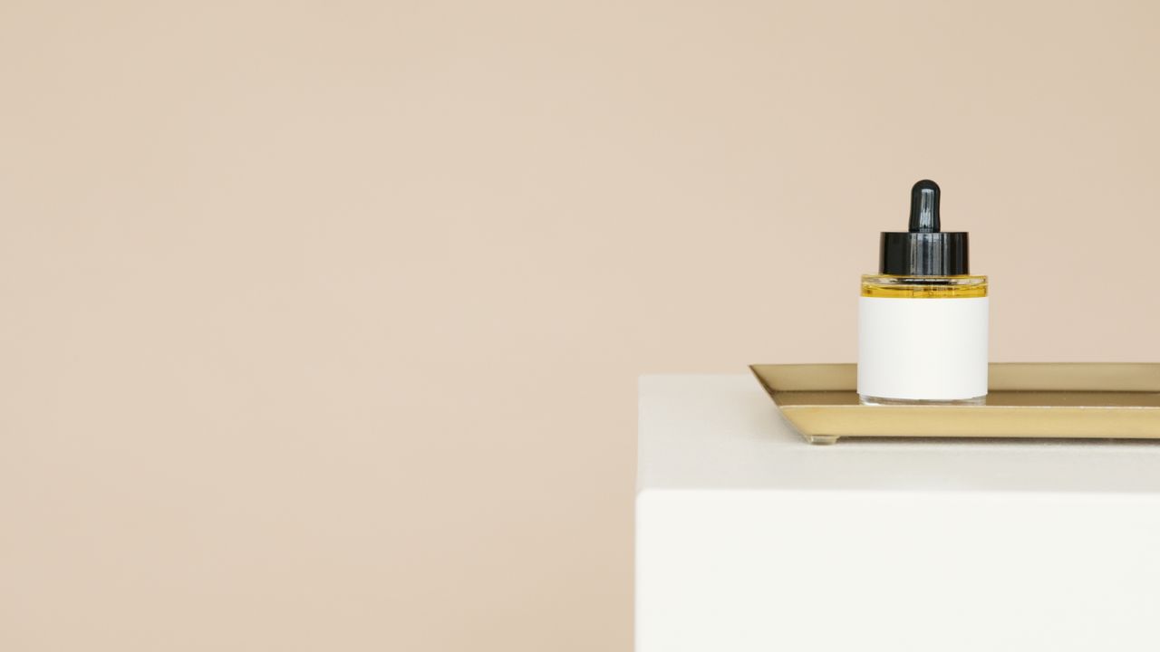 Dropper bottle of oil on a tray
