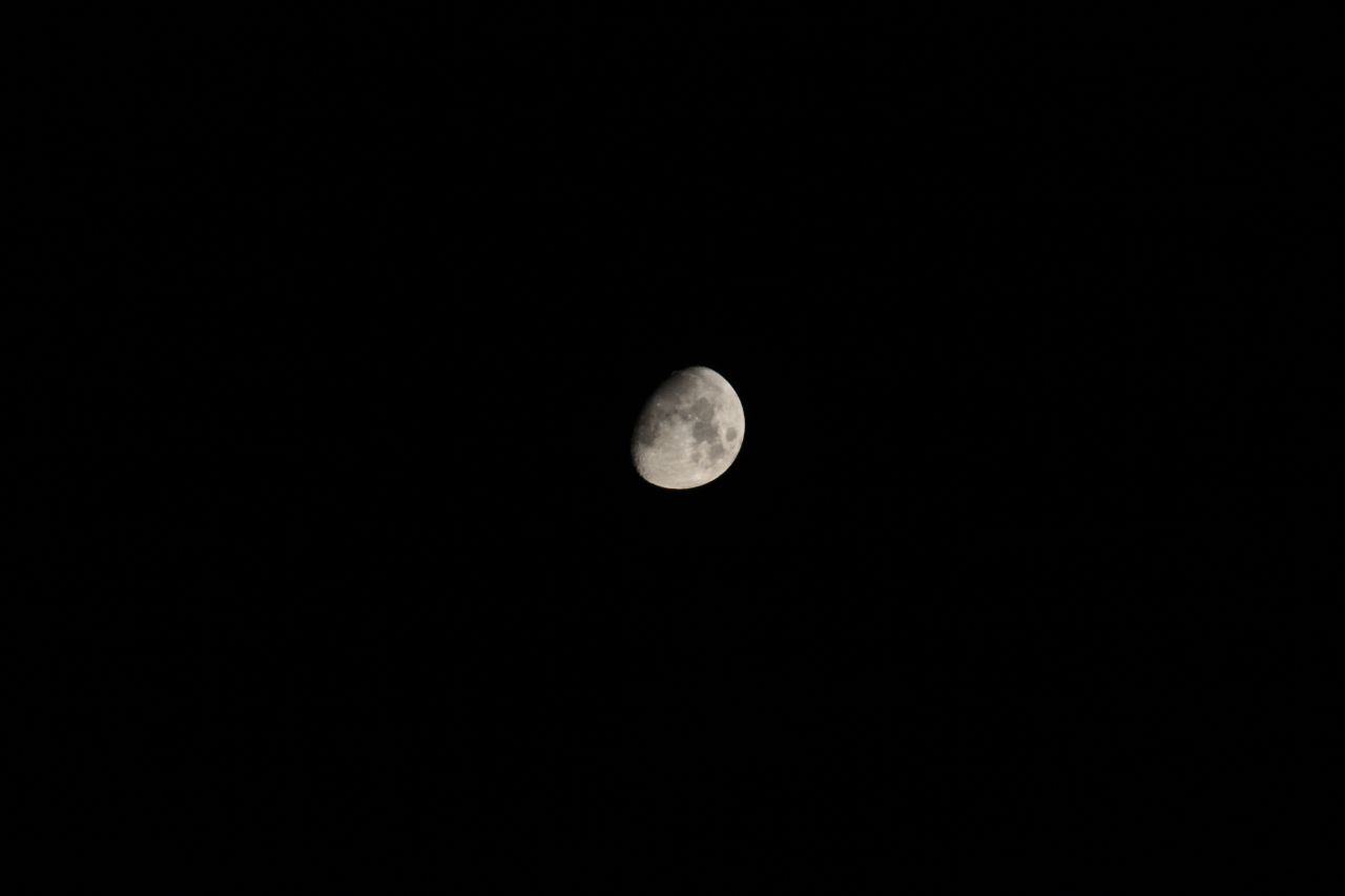 Crescent moon against a black night sky