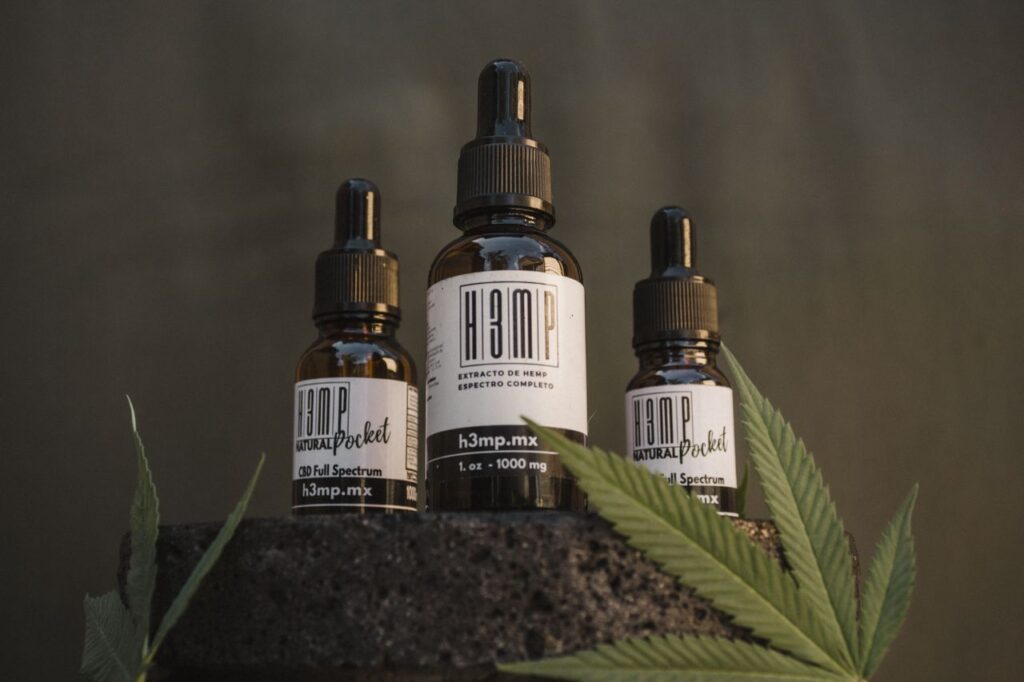 CBD oil bottles with hemp leaves