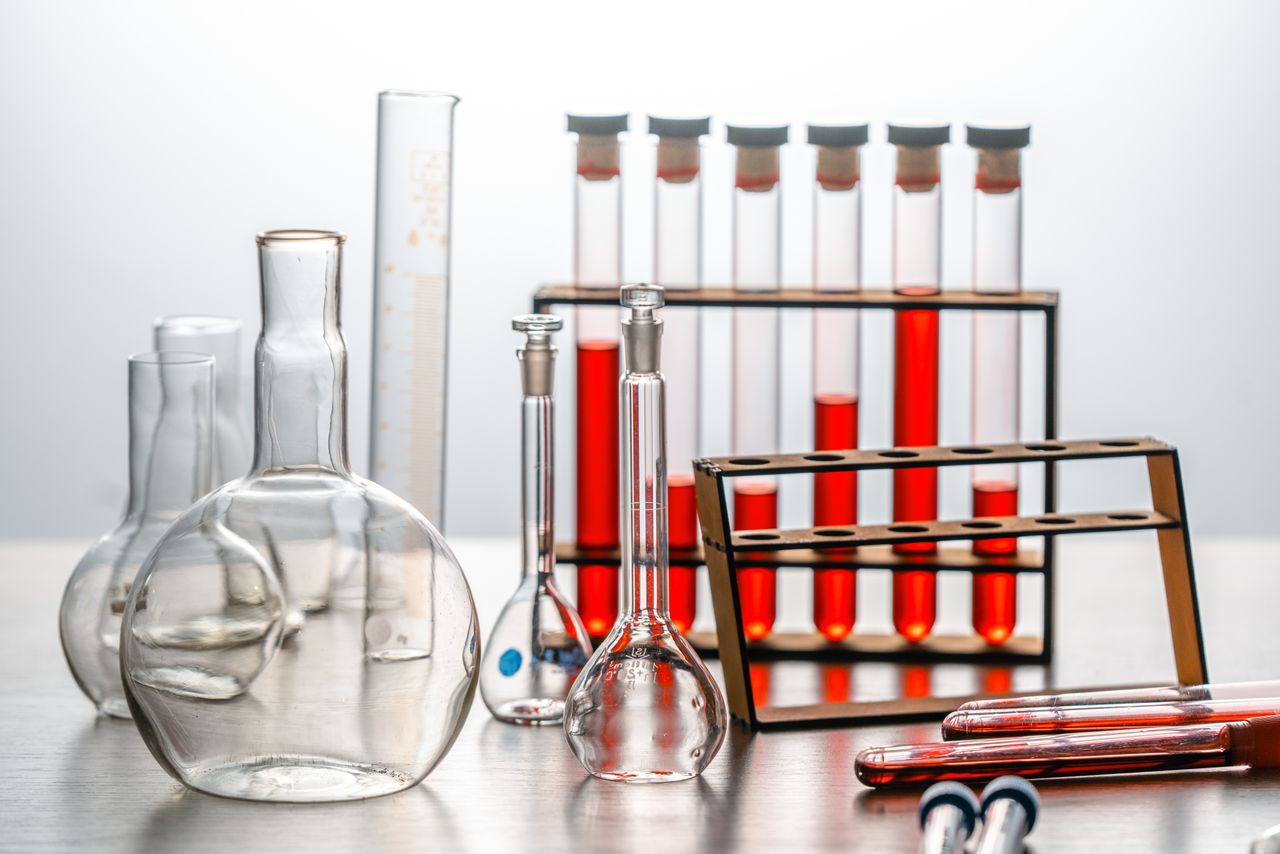 Laboratory glassware with red liquids