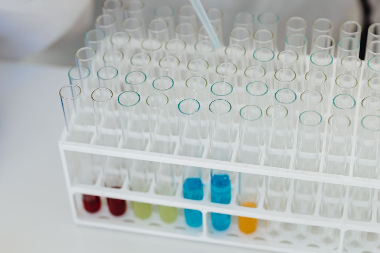 Laboratory test tube rack with colourful solutions