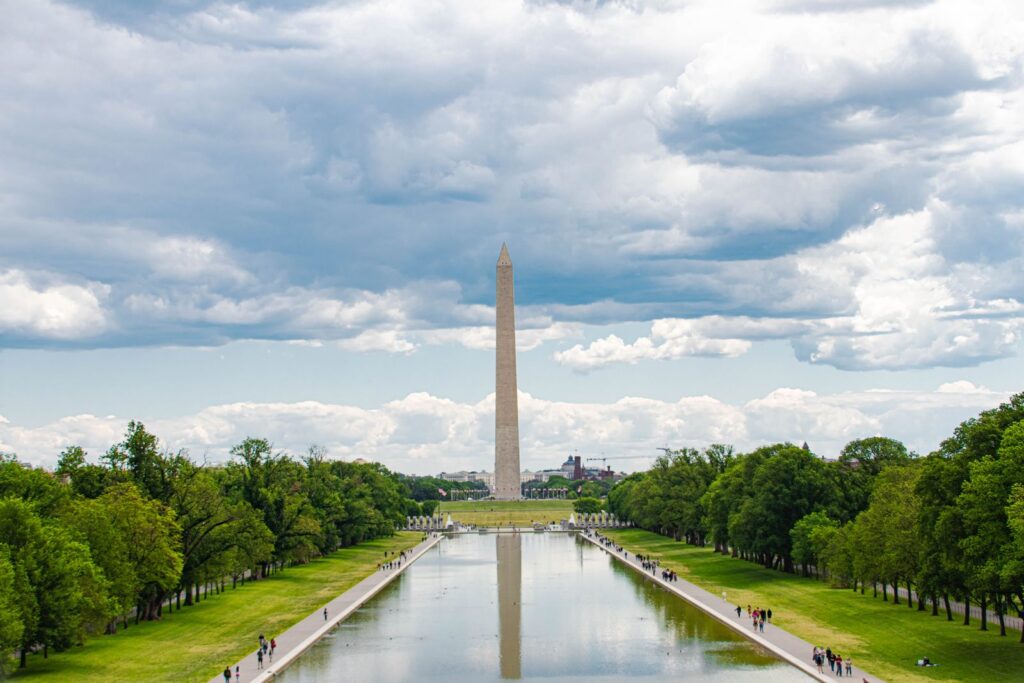 A scenic view of the Washington Monument in Washington, D.C., with reflections