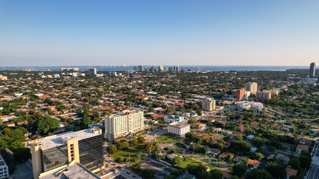 Aerial daytime view of Miami, Florida capturing city skyline and distant ocean