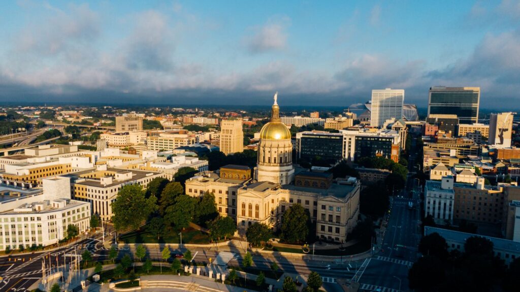 A stunning drone capture of Atlanta's skyline featuring the Georgia State Capitol