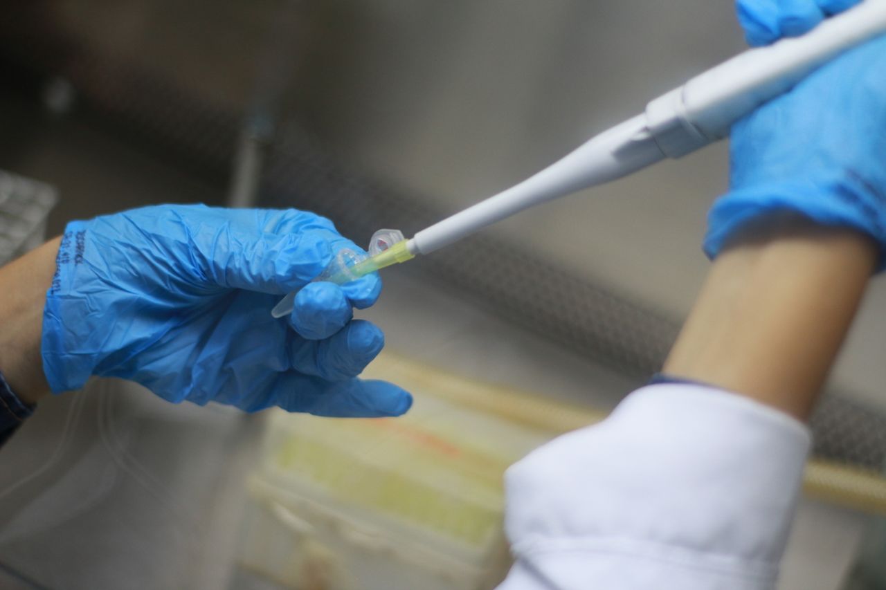 Scientist using a pipette in a laboratory