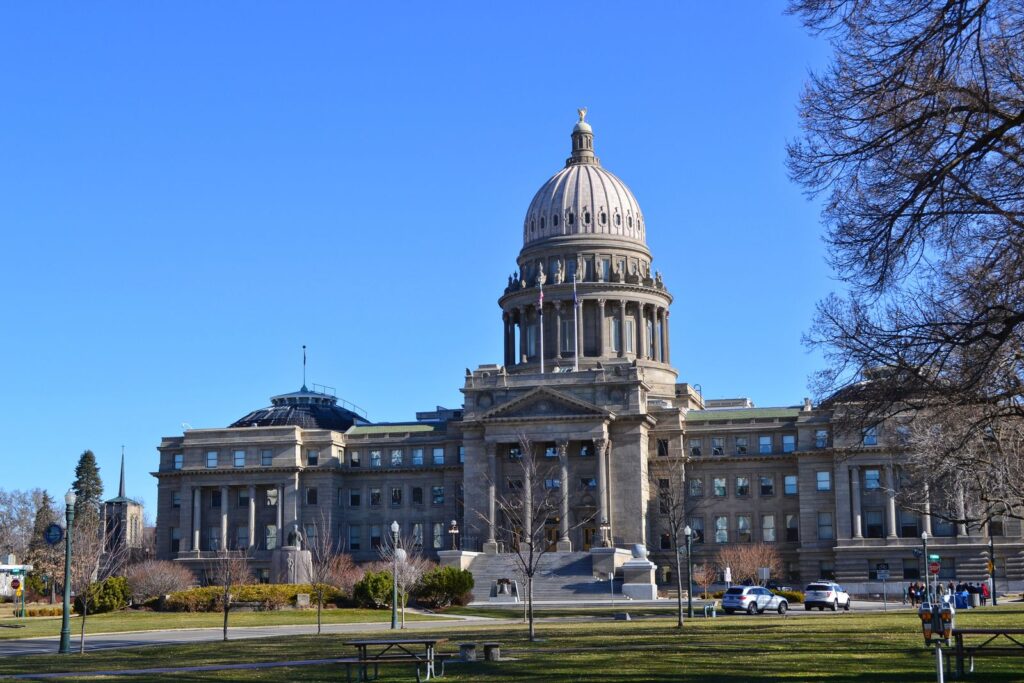 The Idaho State Capitol Building stands majestically under a clear blue sky