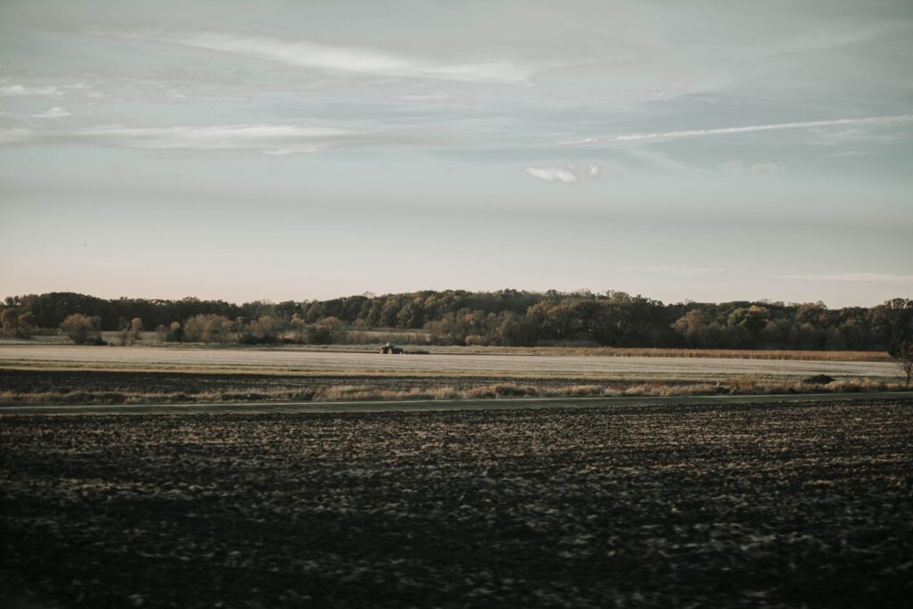 Expansive farmland view under a vast sky in Spring Grove, Illinois