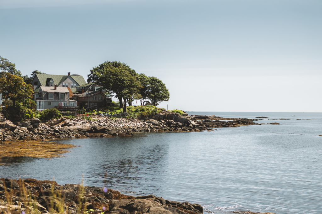 Charming coastal houses by rocky shore in Portland, Maine