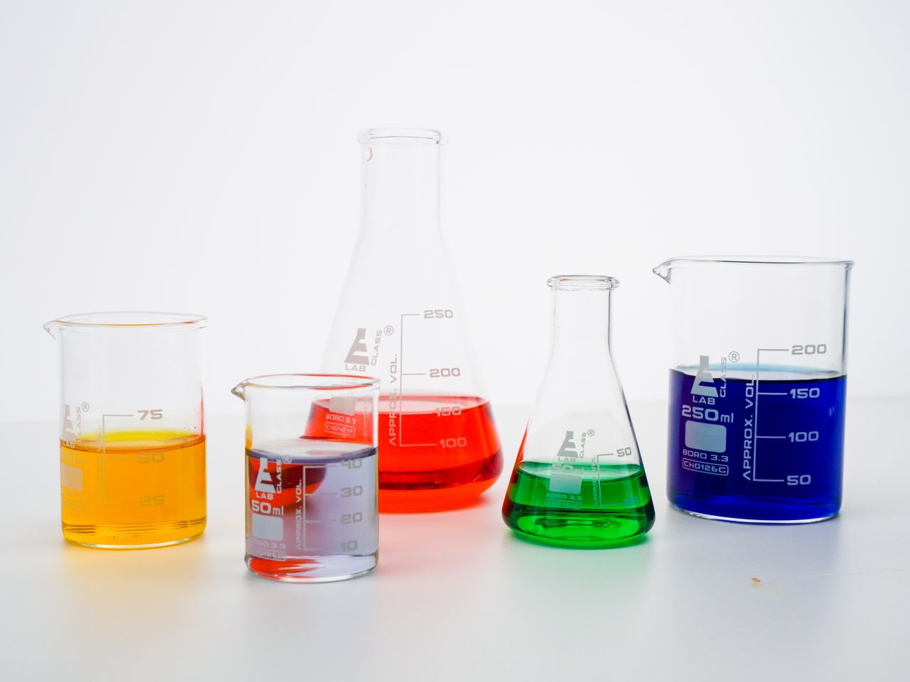 Coloured liquids in laboratory beakers