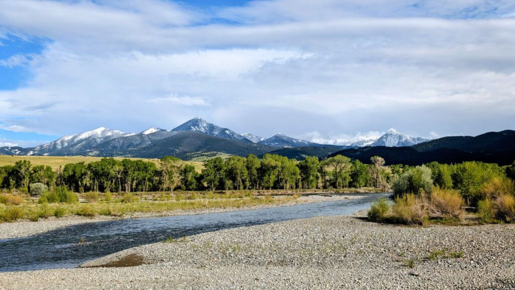 Beautiful river and mountain scene in Livingston, Montana, under a clear blue sky