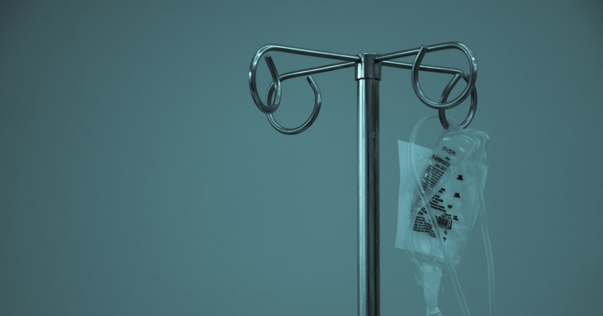 IV bag hanging from a stainless steel drip stand