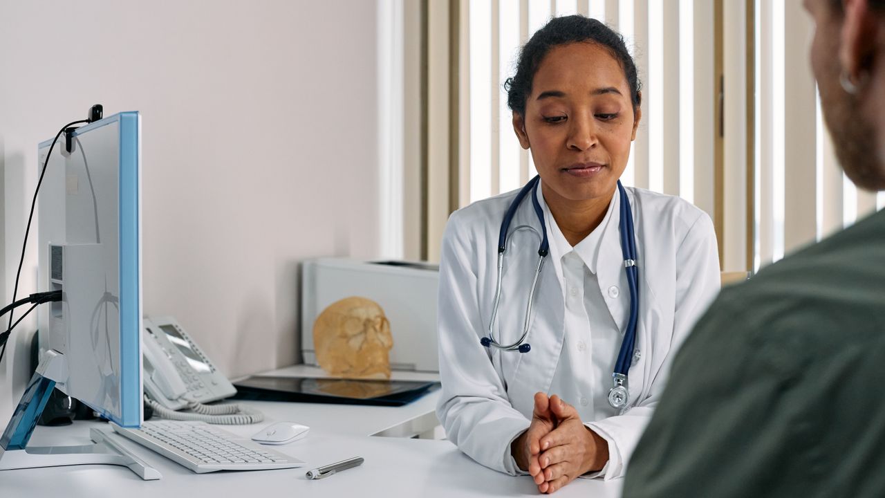 Doctor talking with a patient in a clinic office