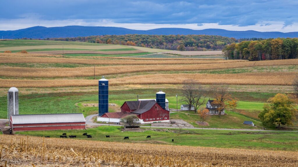 Idyllic farm scene with silo and barn in rural Pennsylvania fields