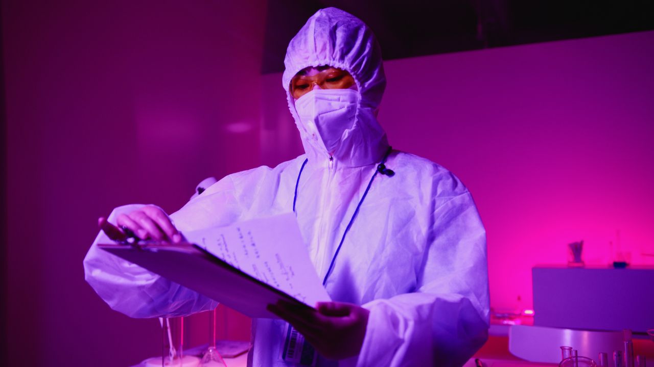 Scientist examining notes in a laboratory