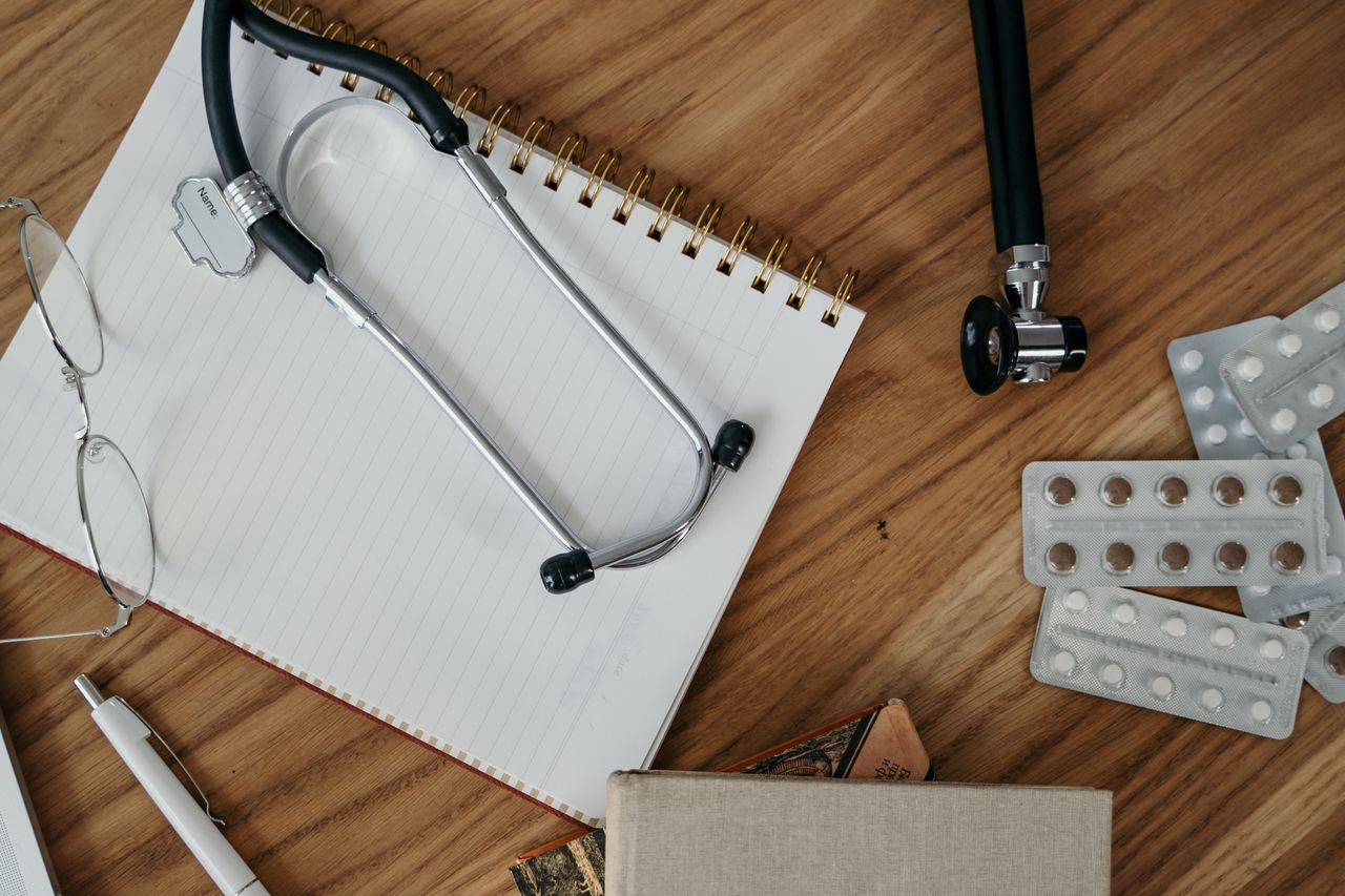 Medical tools and supplies on a wooden desk