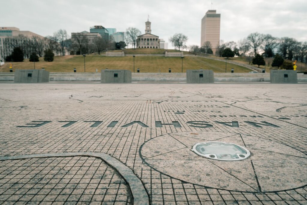Nashville Tennessee State Capitol viewed from the street with city skyline in