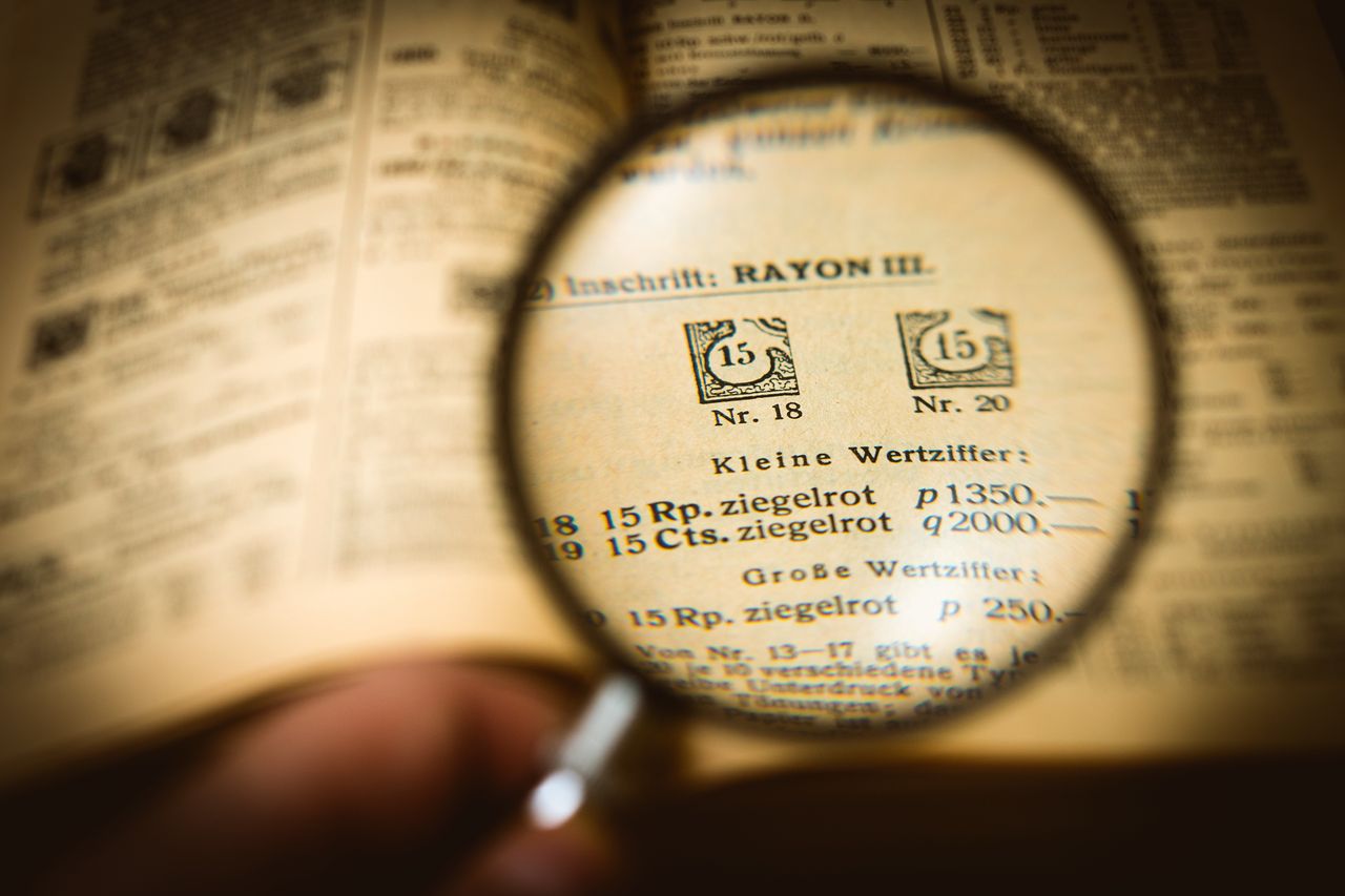 Book page magnified by a glass