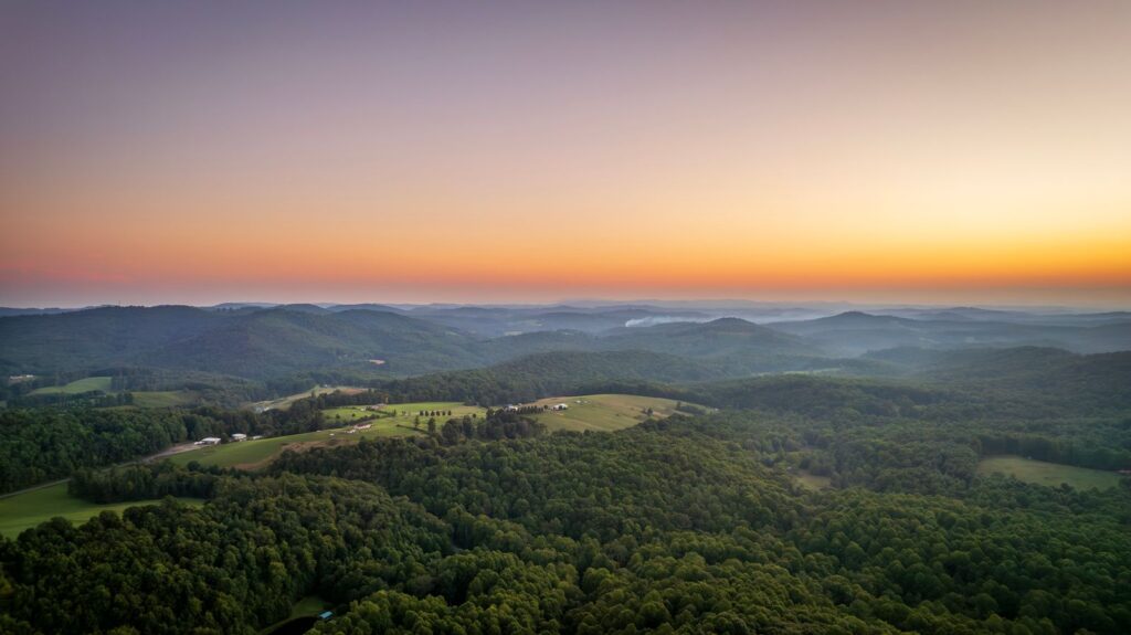 Aerial landscape of rolling hills in Meadows of Dan, Virginia at sunset