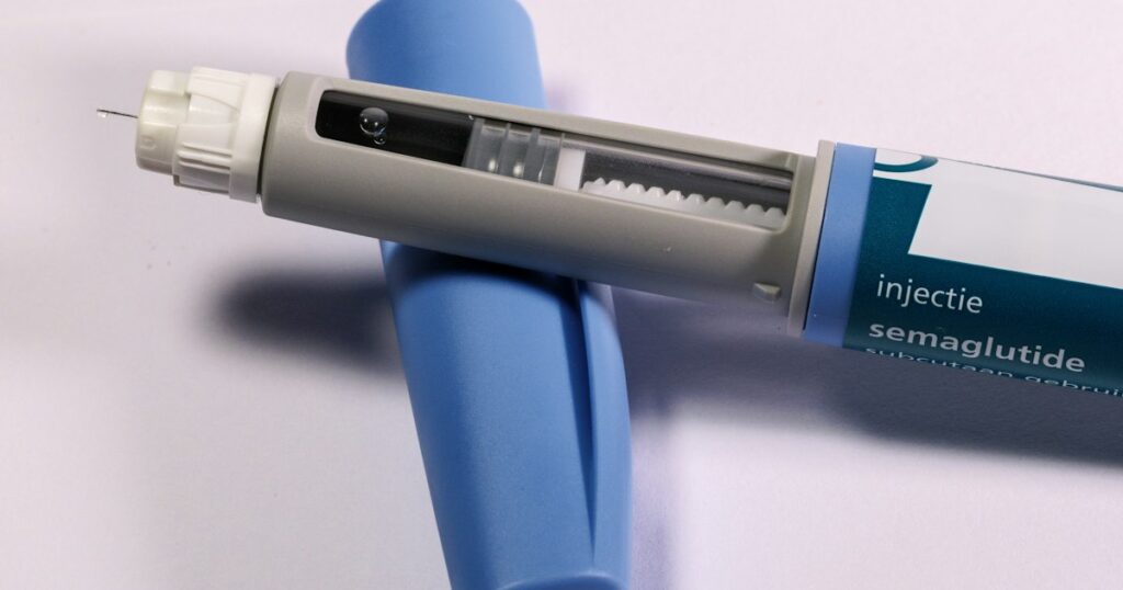 Semaglutide injection pen on a light background
